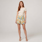 Pamela Boutique beige floral A-line pleated shorts, model view