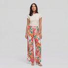 Pamela Boutique pink floral wide-leg flared trousers, model view