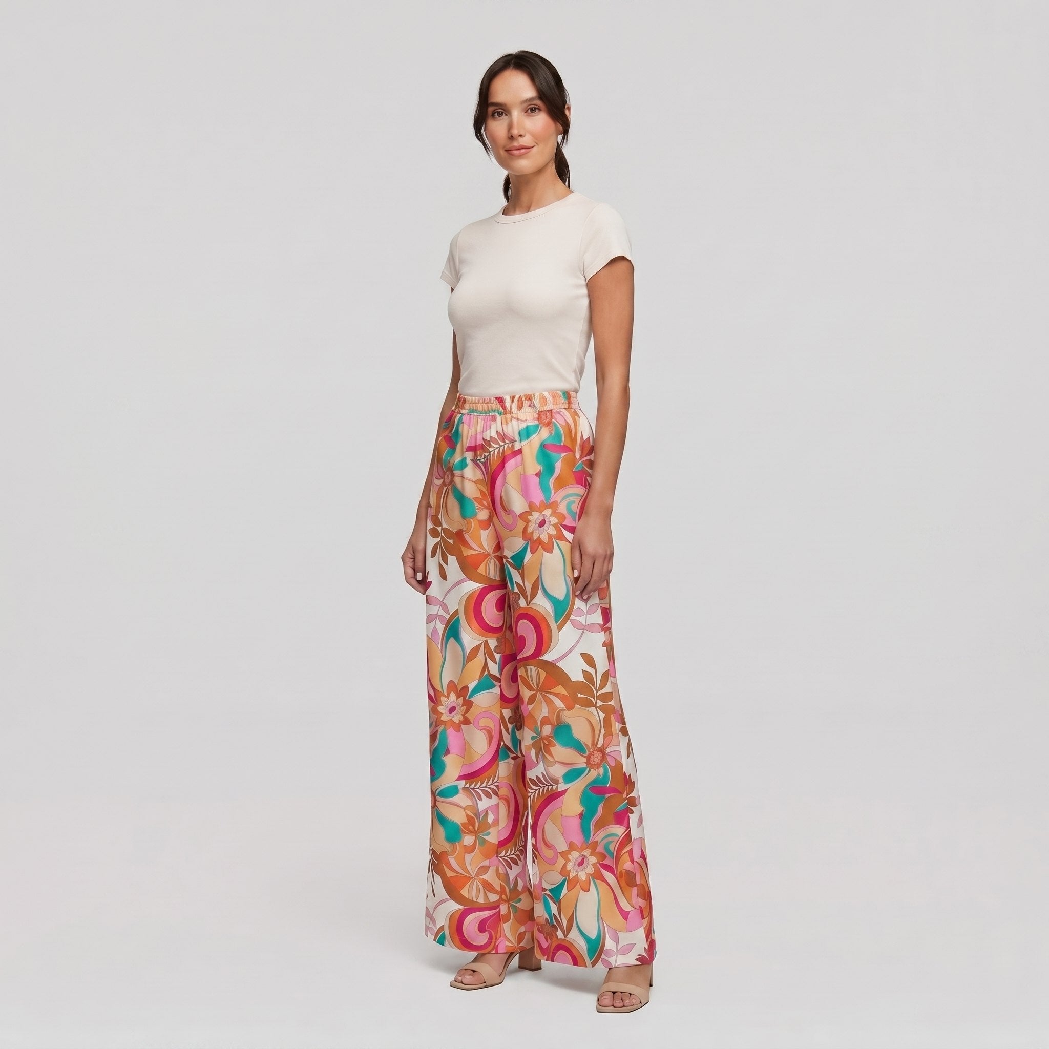 Pamela Boutique pink floral wide-leg flared trousers, model angle pose