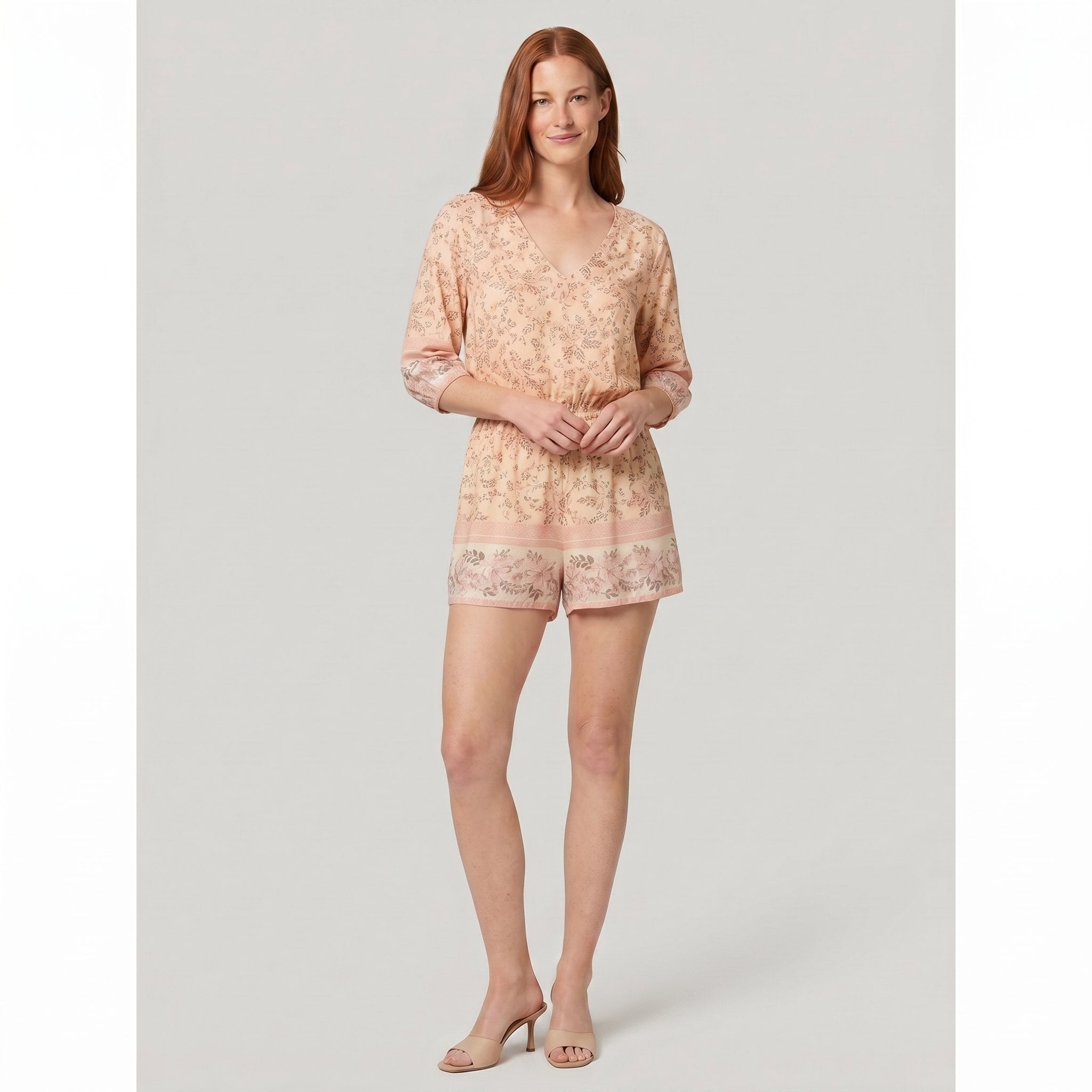Beige floral playsuit on model, front pose - Pamela Boutique