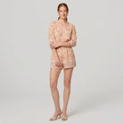 Beige floral playsuit on model, full length - Pamela Boutique