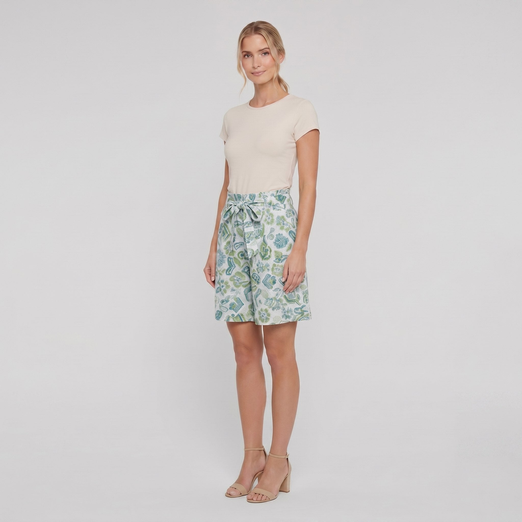 Pamela Boutique mint floral pleated shorts, model angle pose