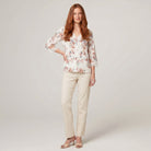 Pamela Boutique floral print V-neck blouse with crochet trim, model front view