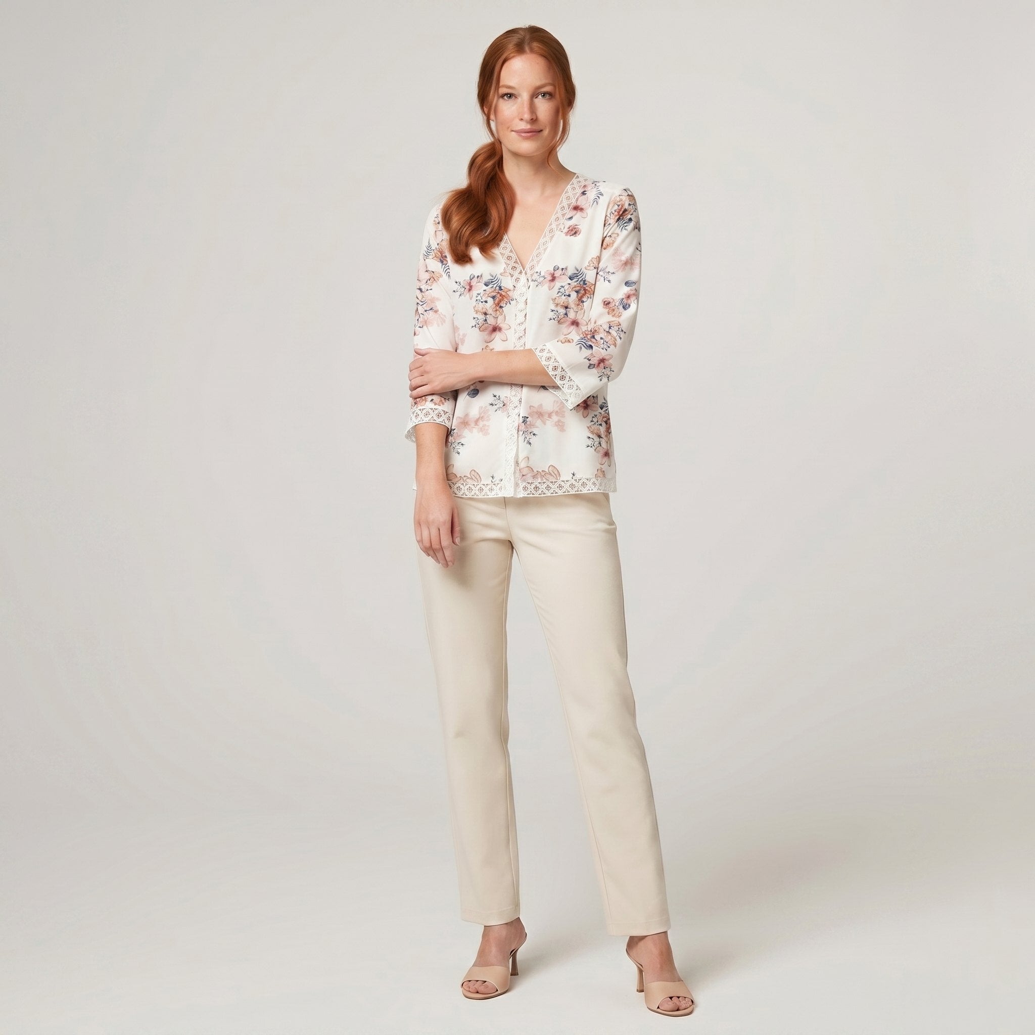 Pamela Boutique floral V-neck blouse, model side pose