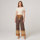 Pamela Boutique brown floral wide-leg trousers, model view