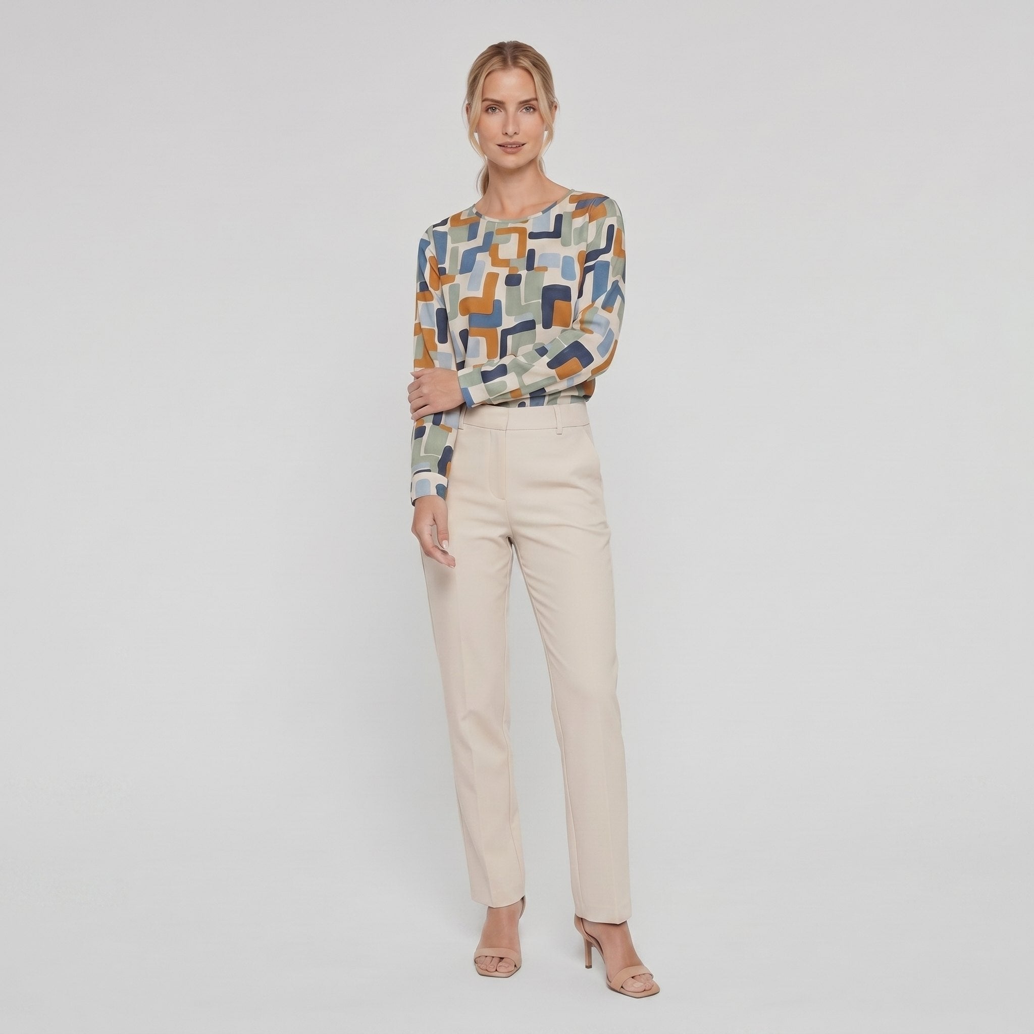 Pamela Boutique geometric print crew blouse, model side pose