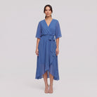 Cornflower blue Gina wrap midi dress with V-neck and flutter sleeves on model