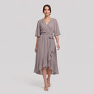 Taupe grey Gina wrap midi dress with V-neck and flutter sleeves on model