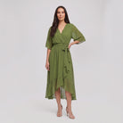 Olive green Gina wrap midi dress with V-neck and flutter sleeves on model