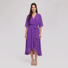 Violet purple Gina wrap midi dress with V-neck and flutter sleeves on model