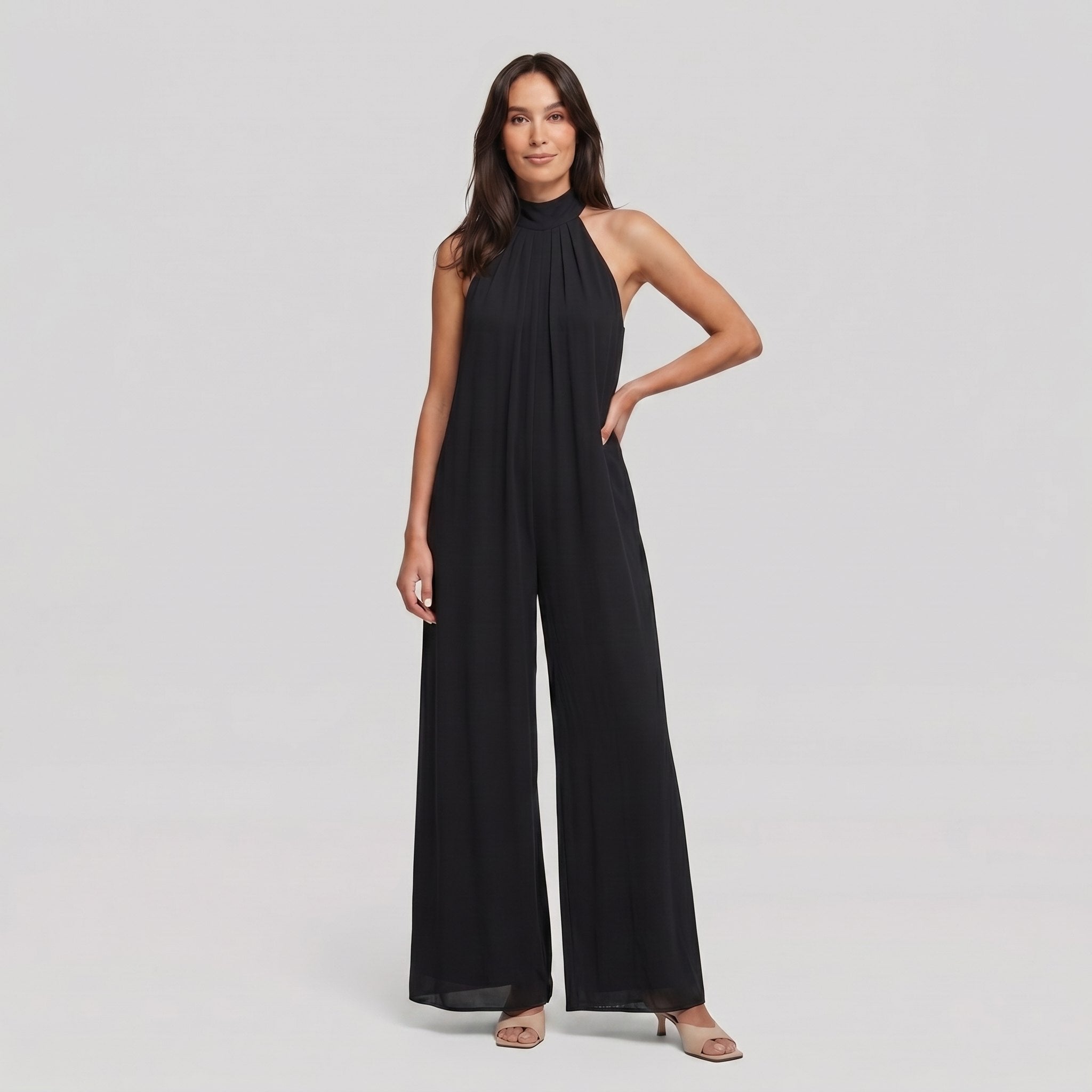 Black halter neck wide leg jumpsuit, model standing - Pamela Boutique