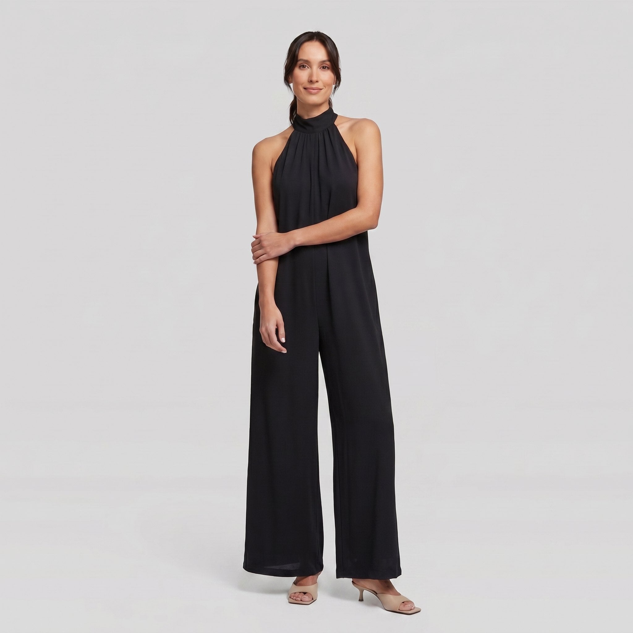 Black halter neck wide leg jumpsuit on model, full length - Pamela Boutique