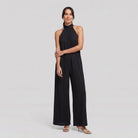Black halter neck wide leg jumpsuit on model, full length - Pamela Boutique