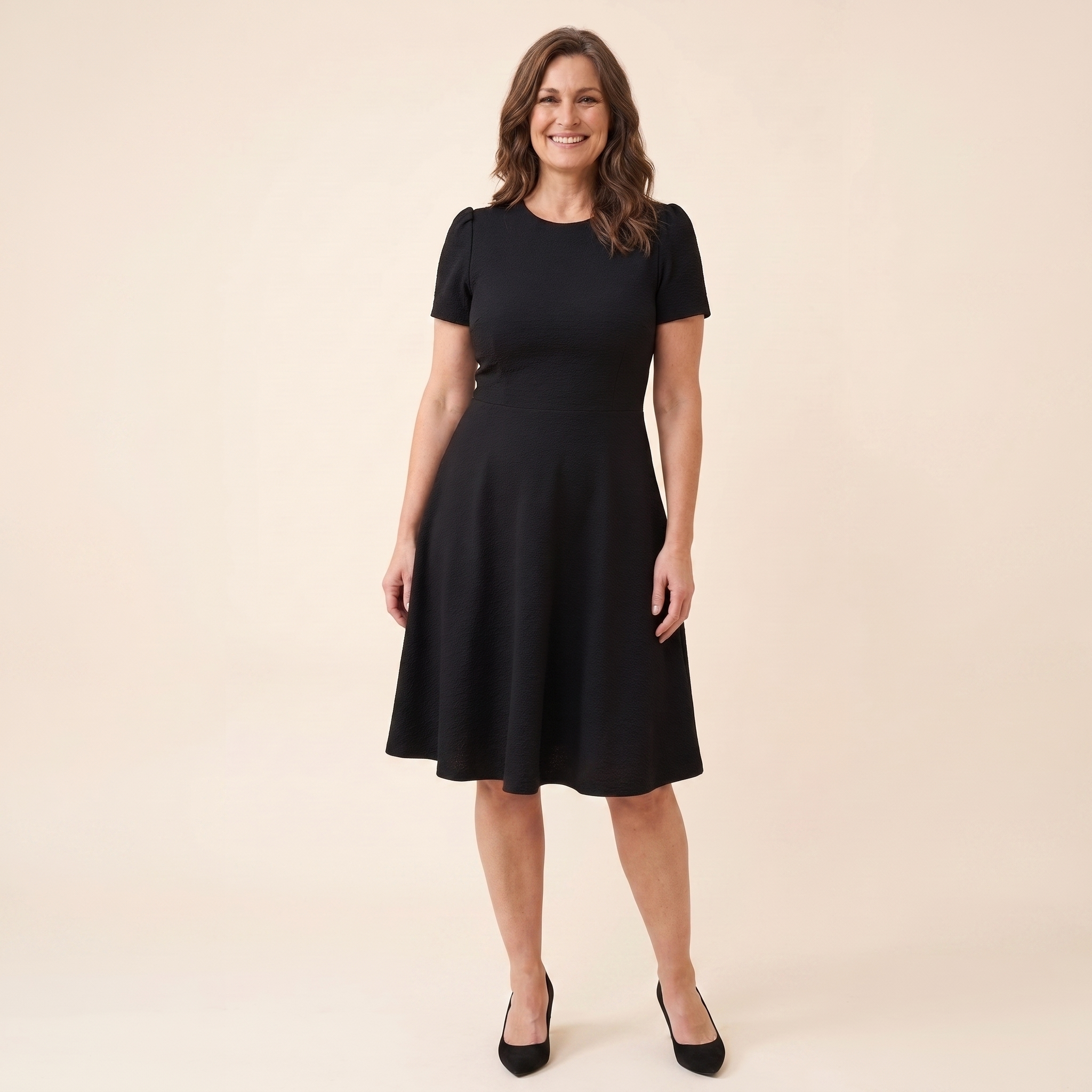 Ivy Midi Dress in black textured crepe, model front view — front