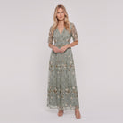 Sage green floral maxi dress with V-neck on model