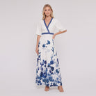 White and blue floral maxi dress with V-neck on model