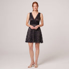 Black floral lace mini dress with deep V-neck and waist sash