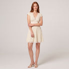 White polka dot lace mini dress, alternate pose