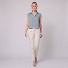 Sky blue linen sleeveless crop top with open collar, on model