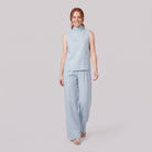 Mira two-piece set in light blue, sleeveless high-neck blouse with wide-leg trousers