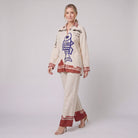 Rounelle cream linen set, walking pose showing relaxed fit