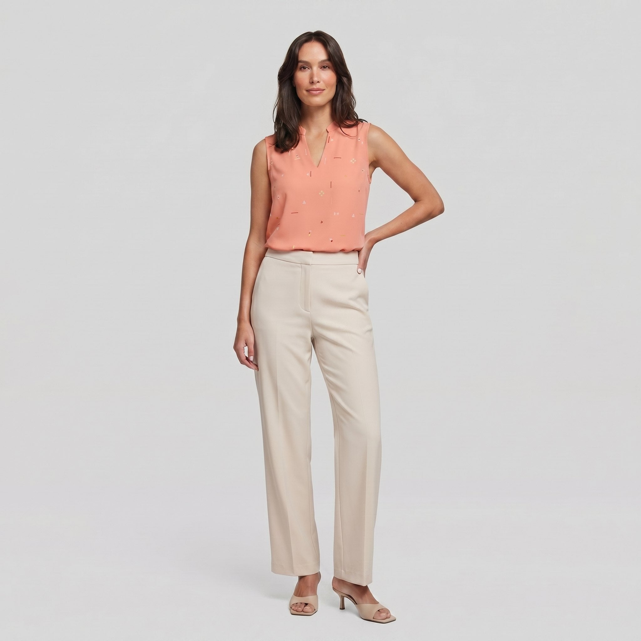 Pamela Boutique peach sleeveless V-neck blouse, model front view