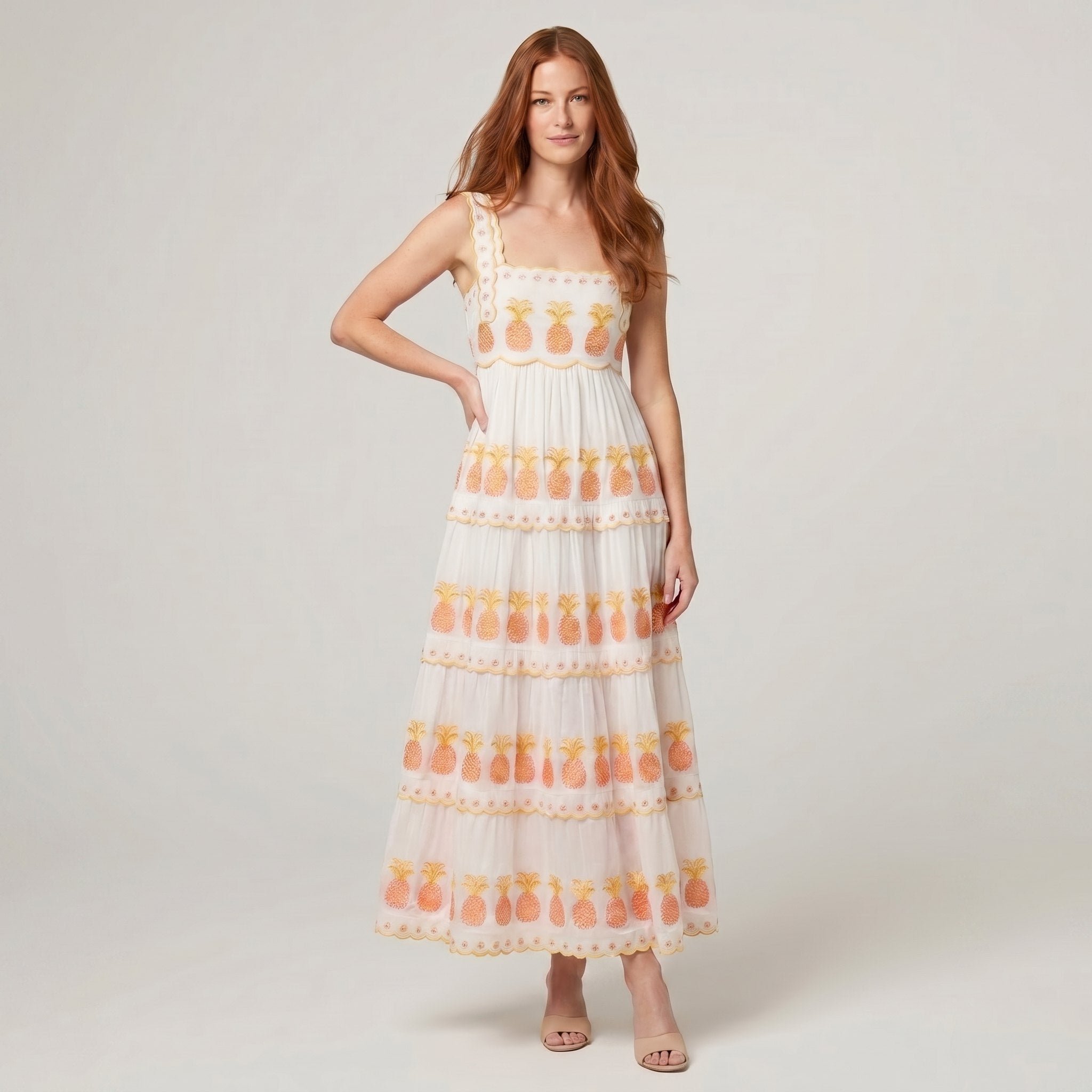 Women's white square-neck tiered maxi dress with pineapple embroidery, full-length model photo