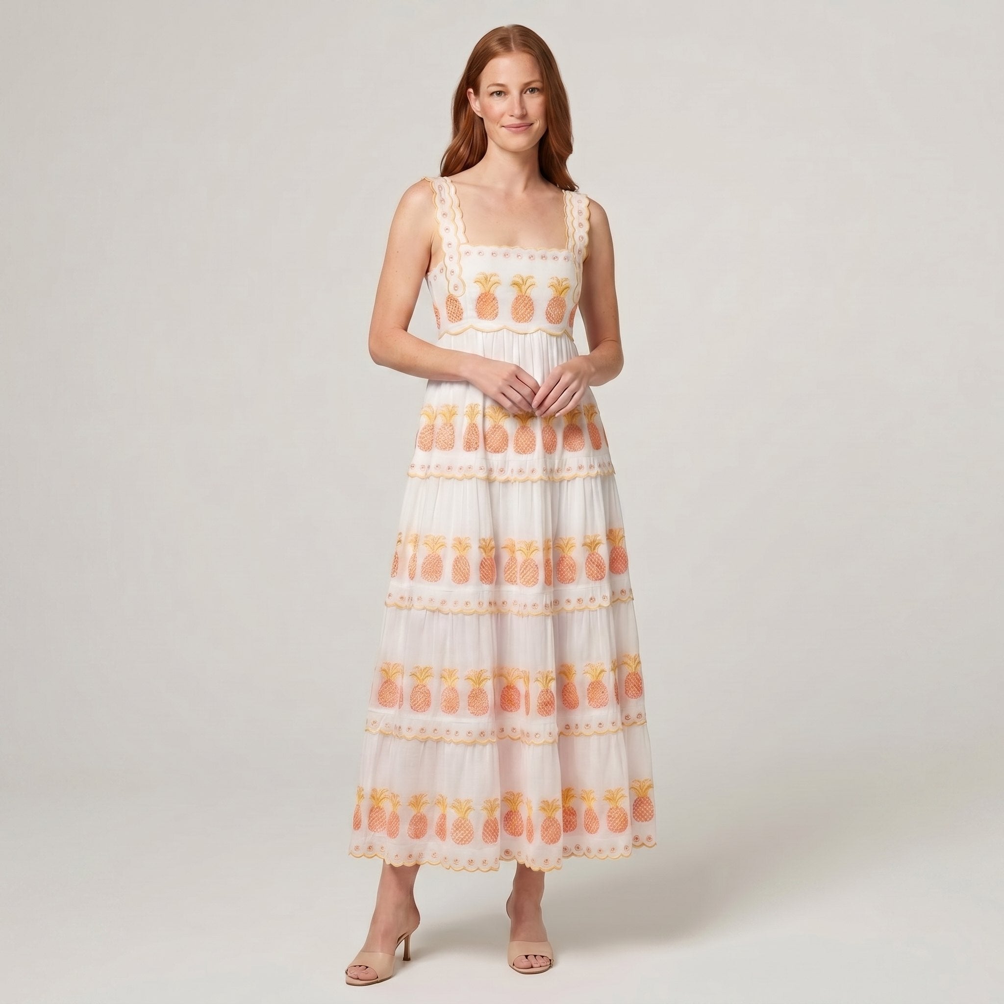 White pineapple-embroidered tiered maxi dress, front view on model