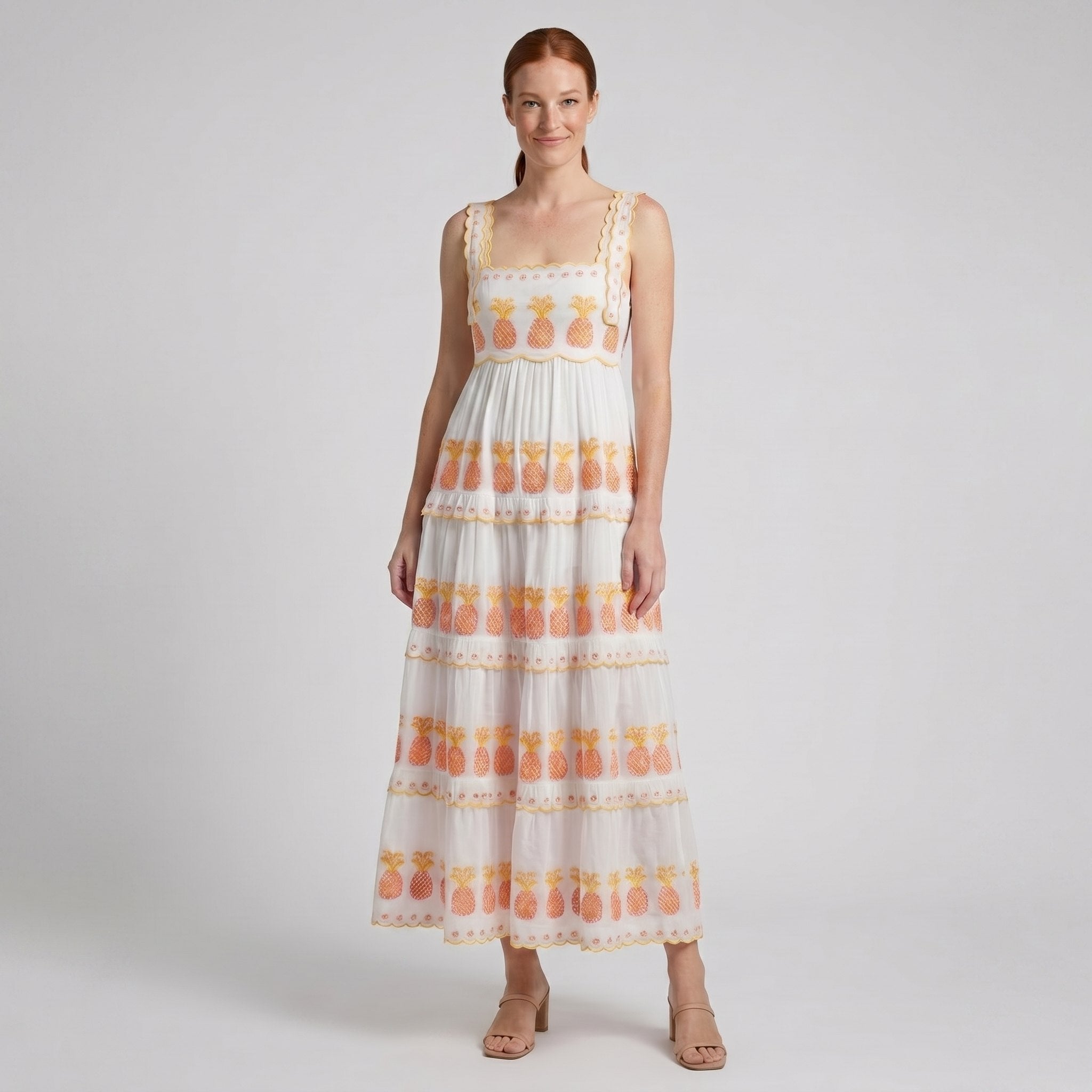 White square-neck tiered maxi dress, three-quarter view on model