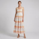 White square-neck tiered maxi dress, three-quarter view on model