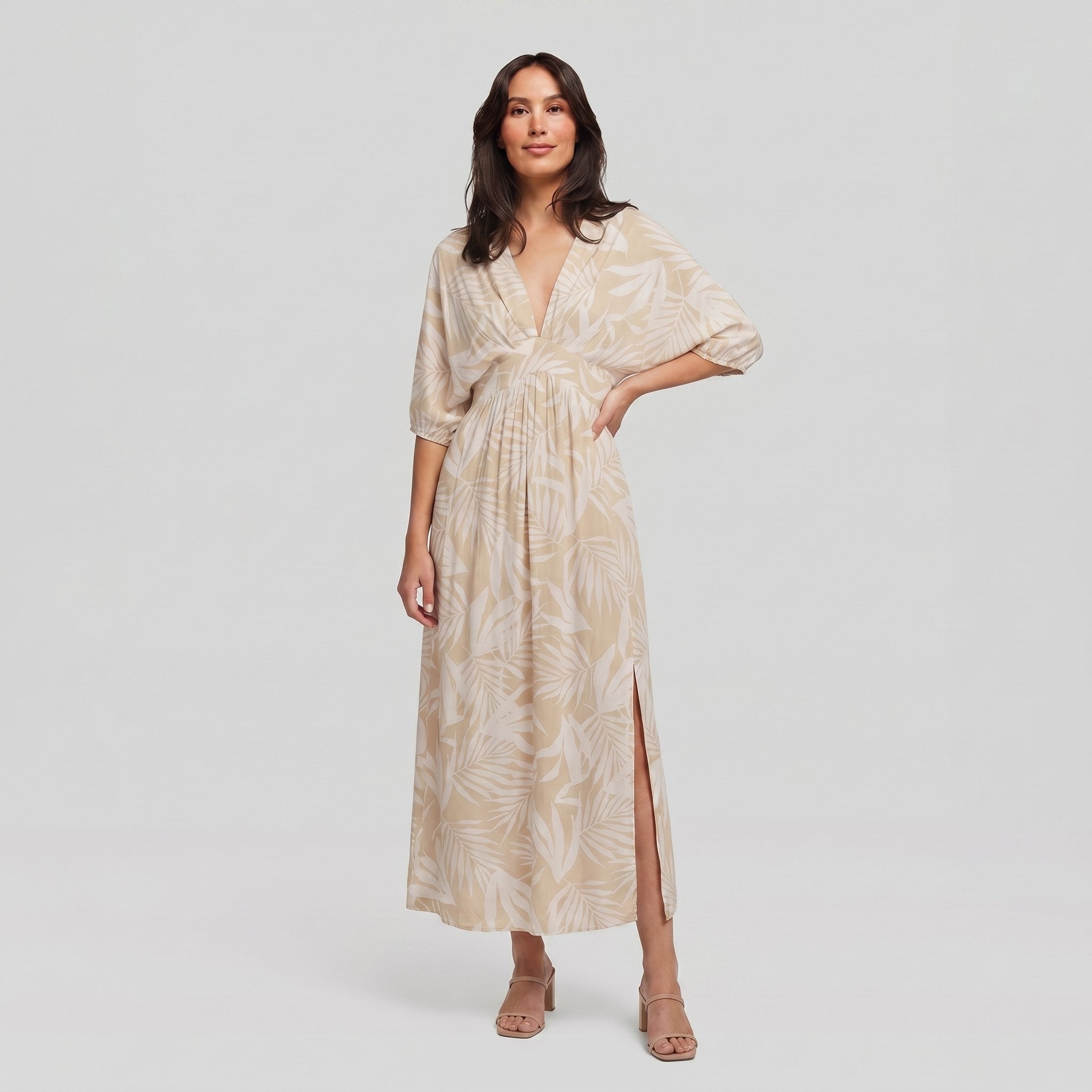 Women's beige tropical-print A-line maxi dress with 3/4 sleeves, full-length model photo