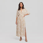 Women's beige tropical-print A-line maxi dress with 3/4 sleeves, full-length model photo