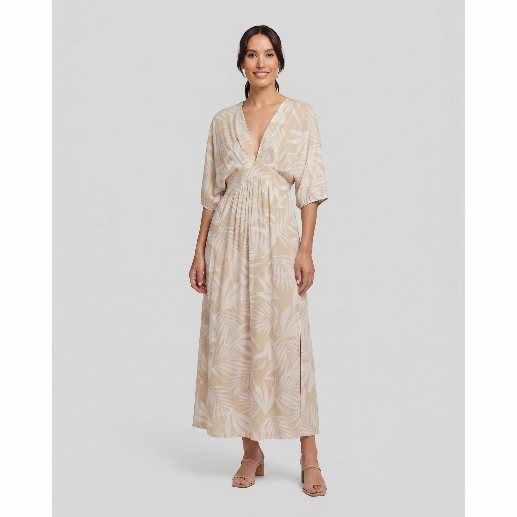 Beige tropical-print A-line maxi dress, three-quarter view on model