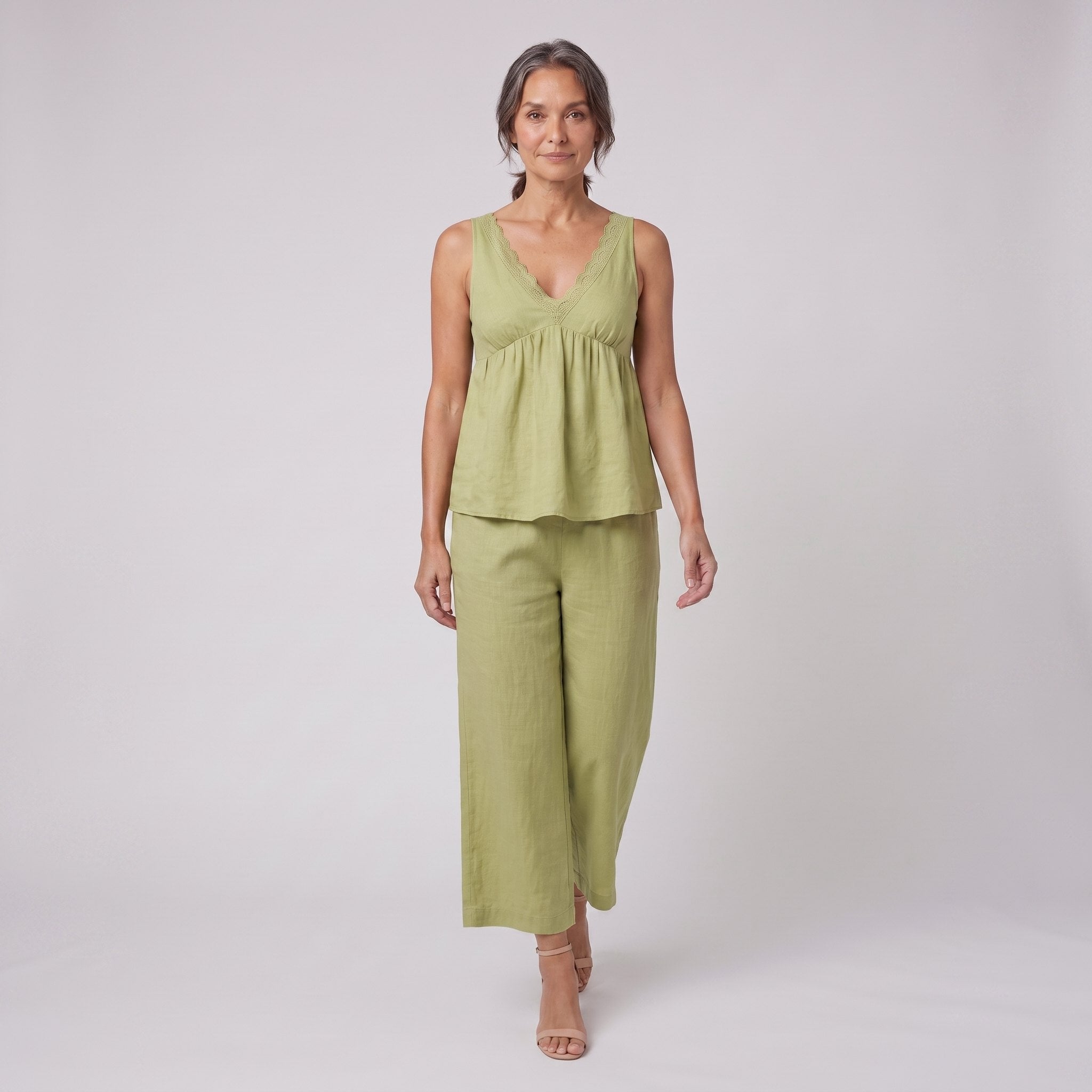 Vera sage green lace-trimmed loungewear set walking