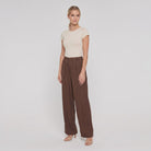 Pamela Boutique brown wide-leg trousers, model angle pose