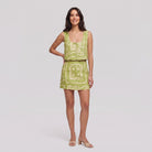 Lime green linen co-ord set with cream bandana print — sleeveless cropped vest top and matching mini skirt, full-length front view