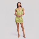 Lime green linen co-ord set with cream bandana print, front view