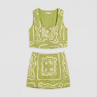 Lime green linen co-ord set, product flat-lay of vest top and mini skirt