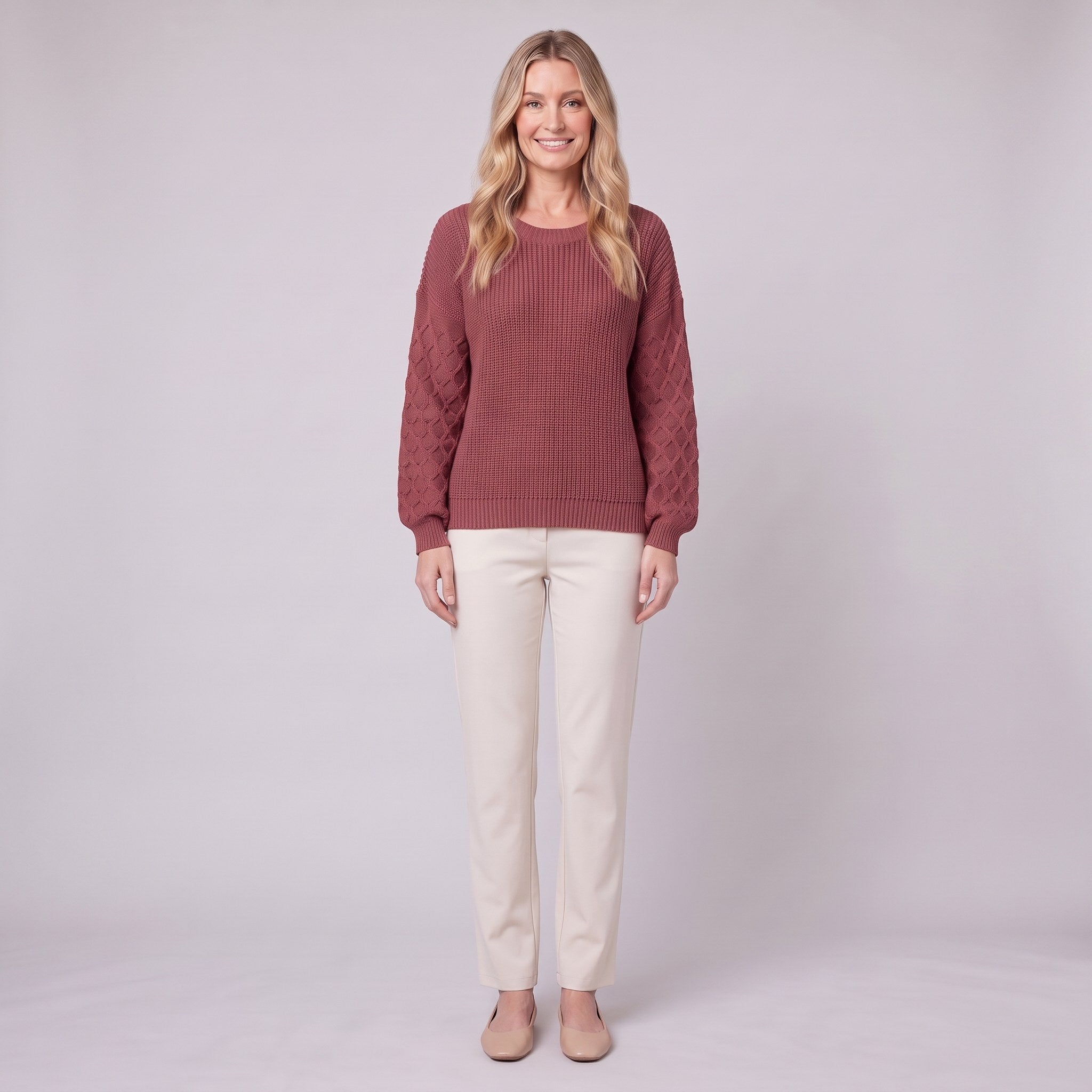 Amalie ribbed pullover in red, diamond-textured sleeves, front view on model