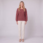 Amalie ribbed pullover in red, diamond-textured sleeves, front view on model