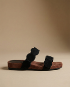 Close view of the croc-embossed texture on the mule, view 5