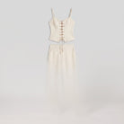 White lace-up top and wide-leg trouser co-ord, product flat lay