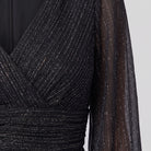 Close-up of the metallic glitter knit and sheer sleeve on the Brym gown