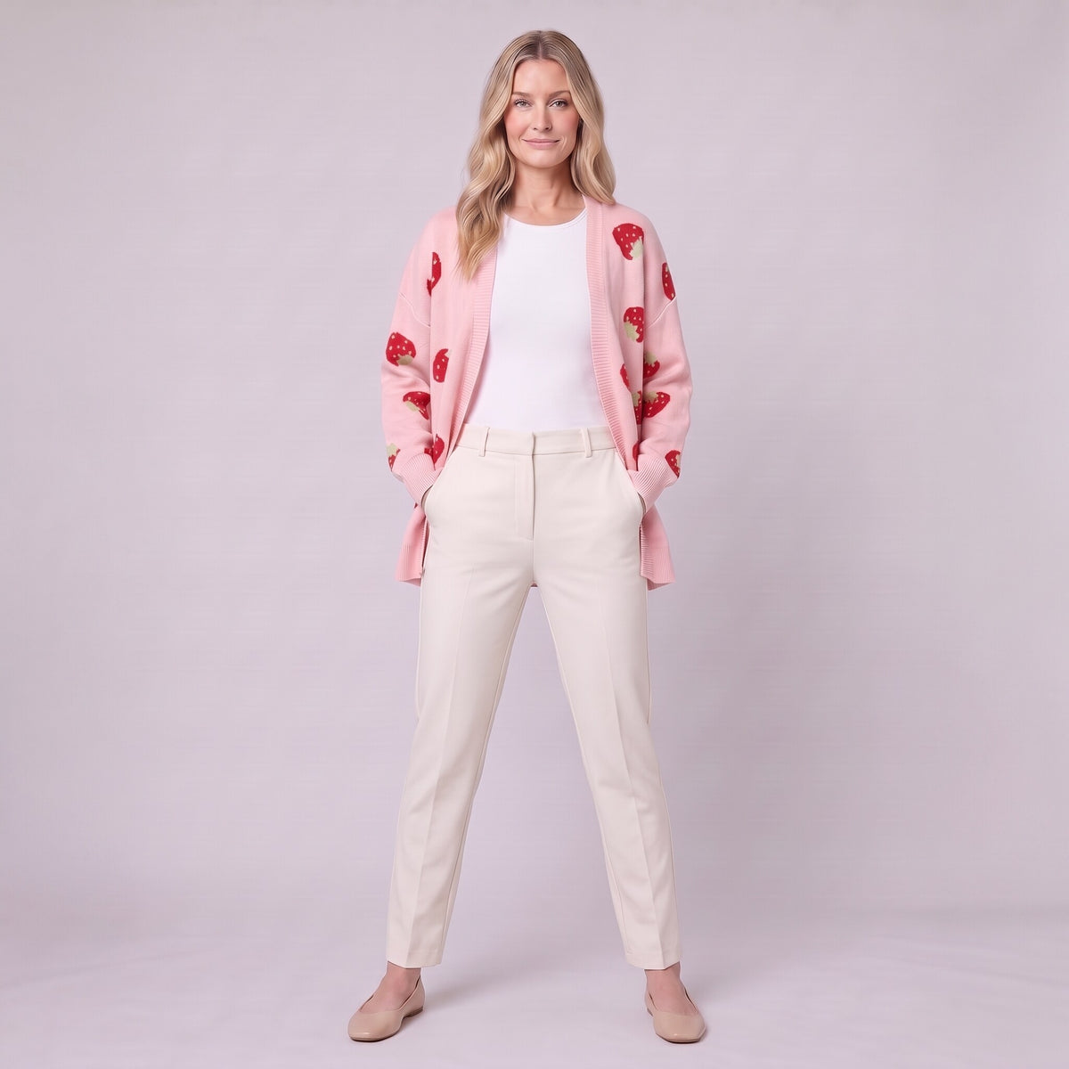 Cerise strawberry cardigan in pink, full length front view on model