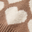 Damaris heart sweater, close-up of the mocha knit with a fuzzy cream heart