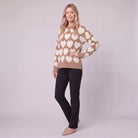 Damaris heart jacquard sweater in mocha and cream, three-quarter view