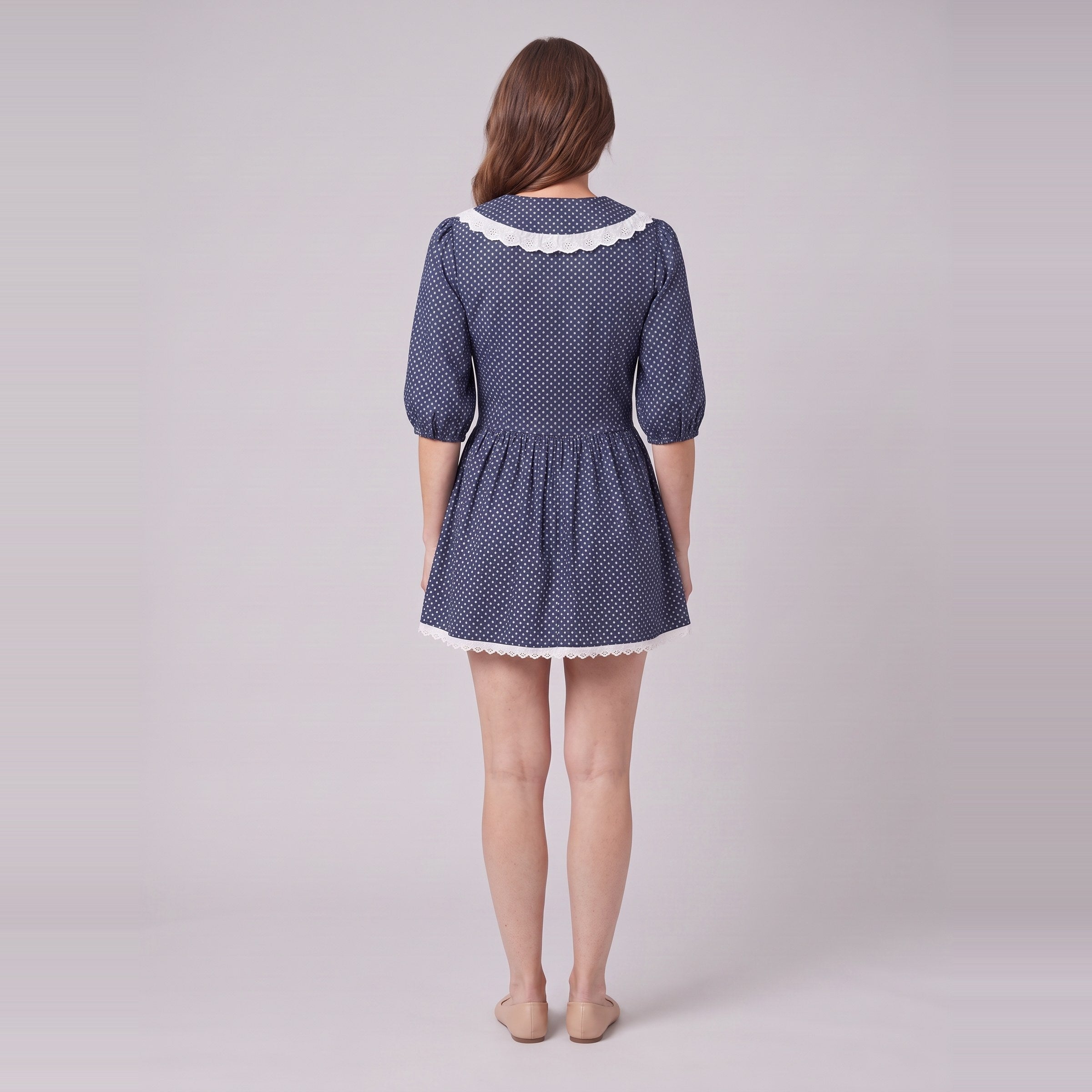 Ellery navy mini dress seen from behind, showing the collar and gathered skirt