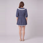 Ellery navy mini dress seen from behind, showing the collar and gathered skirt