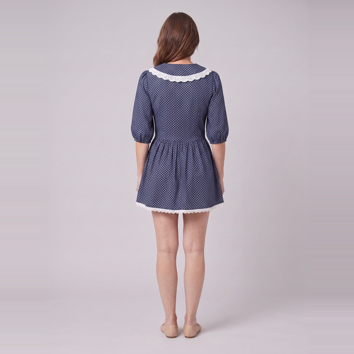 Ellery navy mini dress seen from behind, showing the collar and gathered skirt