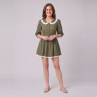 Ellery mini dress in olive green with a white lace collar, front view